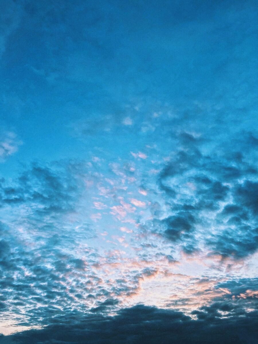 A stunning sky filled with blue and pink clouds during twilight.