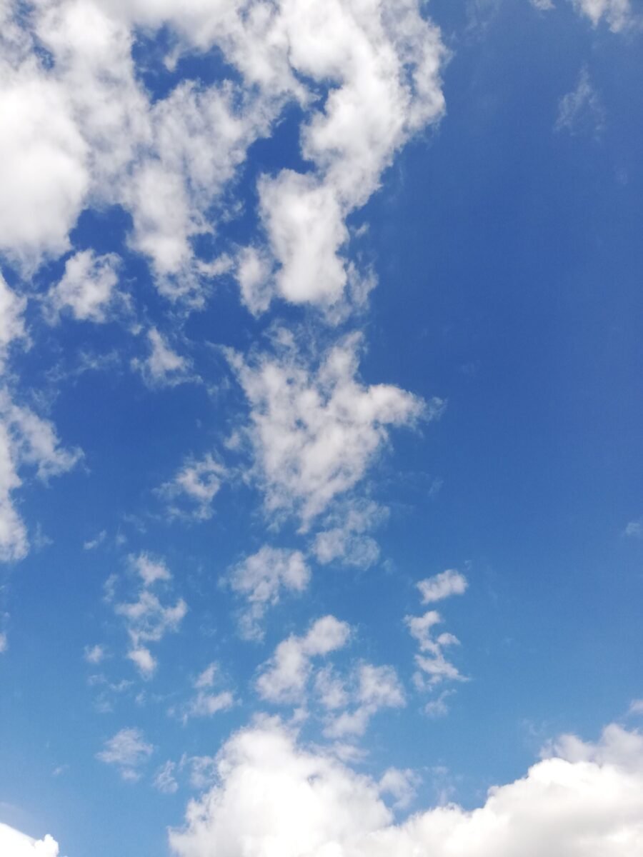 Captivating view of a clear blue sky with fluffy white clouds.